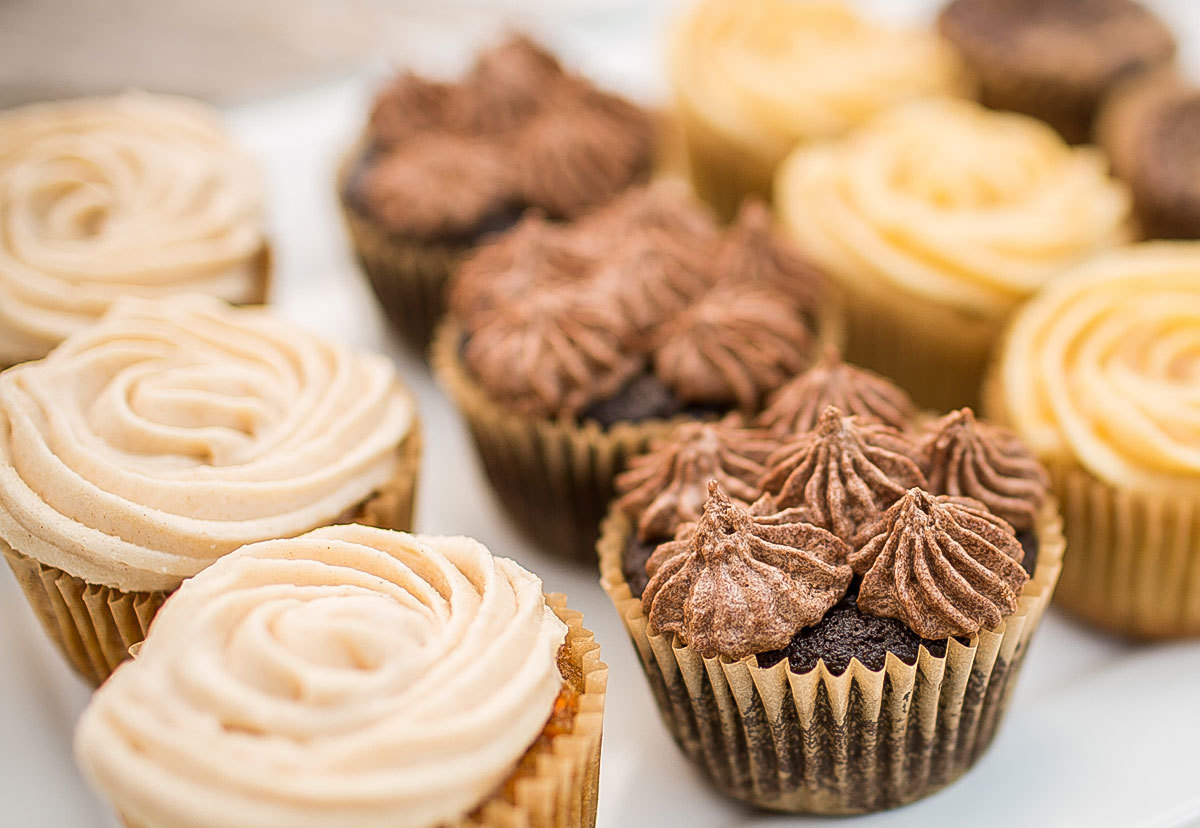 Cupcakes shown in different flavors, frosting